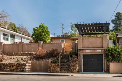 a house with a gate and a garage at Downtown La Mesa gem in La Mesa