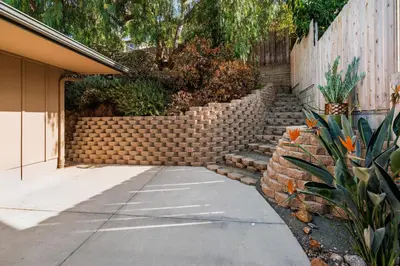 a brick retaining wall next to a sidewalk at Downtown La Mesa gem in La Mesa