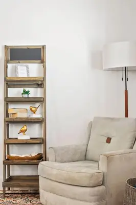 a living room with a couch and a lamp at The Oasis in Escondido