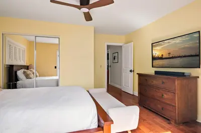 a bedroom with a bed and a ceiling fan at Cozy 3BR Steps to Dining & Attractions in San Diego