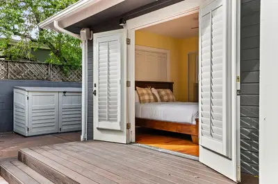 a door leading into a bedroom with a bed at Cozy 3BR Steps to Dining & Attractions in San Diego