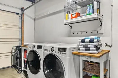 a laundry room with a washer and dryer at Cozy 3BR Steps to Dining & Attractions in San Diego