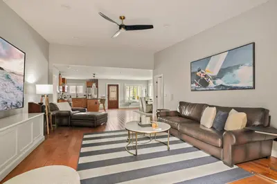 a living room with a couch and a table at Cozy 3BR Steps to Dining & Attractions in San Diego