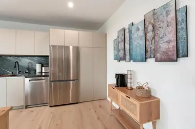 a kitchen with a stainless steel refrigerator at Ocean View Luxury Living in Carlsbad