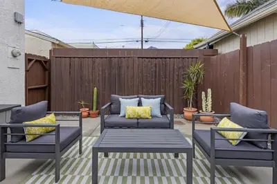 a patio with two chairs and a table at The Stylish Cozy Bungalow in North Park in San Diego