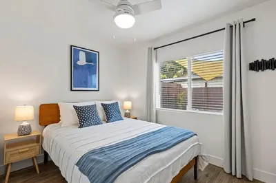 a bedroom with a bed and a window at The Stylish Cozy Bungalow in North Park in San Diego
