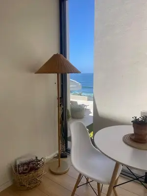 a table and chair with a view of the ocean at La Jolla Suite with Ocean View Patio in San Diego