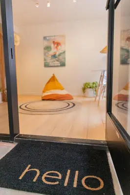 a door with a welcome mat in a room at La Jolla Suite & Beach Access in San Diego