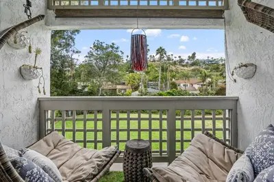 a view from a window of a porch with a couch at Breeze & Bridle - TC530J in Solana Beach