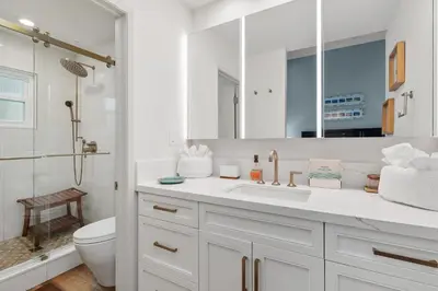 a white bathroom with a sink and a toilet at Breeze & Bridle - TC530J in Solana Beach