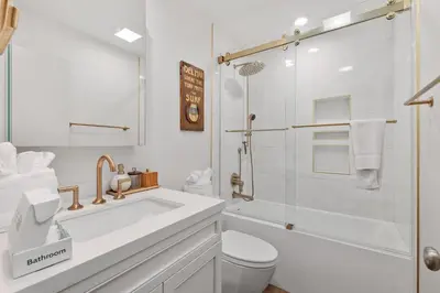 a white bathroom with a toilet and a shower at Breeze & Bridle - TC530J in Solana Beach