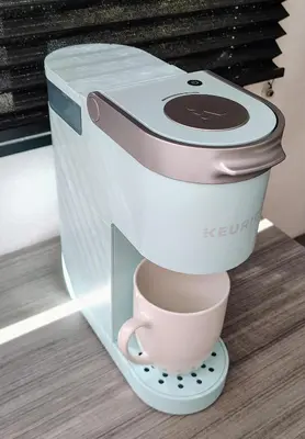 a coffee maker with a cup on top of it at The Owl House in Spring Valley