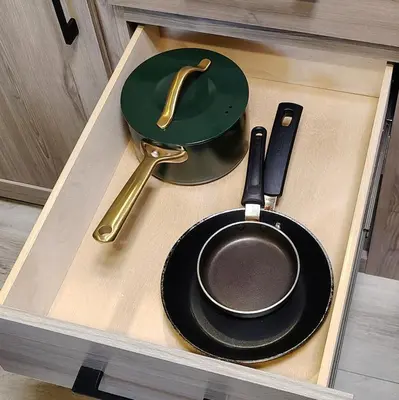 a drawer with a frying pan and utensils in it at The Owl House in Spring Valley