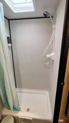 a bathroom with a shower with a shower head at The Owl House in Spring Valley