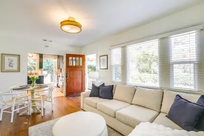 a living room with a couch and a table at half Mi to Balboa Park Cottage with Private Yard! in San Diego