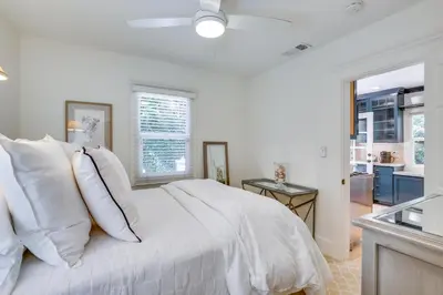 a bedroom with a white bed with white pillows at half Mi to Balboa Park Cottage with Private Yard! in San Diego