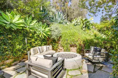 a garden with a fire pit and two chairs at half Mi to Balboa Park Cottage with Private Yard! in San Diego
