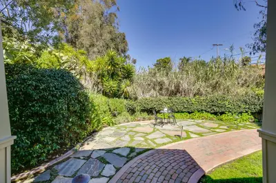a garden with a brick walkway in a yard at half Mi to Balboa Park Cottage with Private Yard! in San Diego