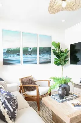 a living room with a couch and a table at Chic Surf Lodge with Hot Tub & Ocean Views in Oceanside