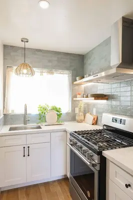 a kitchen with white cabinets and a stove top oven at Chic Surf Lodge with Hot Tub & Ocean Views in Oceanside