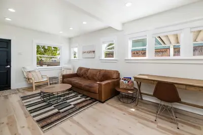 a living room with a couch and a table at Modern Gem in North Park in San Diego