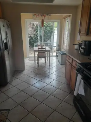 a kitchen with a table and a dining room at Big Beautiful Master Bedroom in Bonita