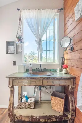 a bathroom with a sink and a window at African-Inspired Safari Tent near San Diego for a Glamping Weekend in Vista, California in Vista