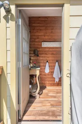 a door leading into a room with a wooden wall at African-Inspired Safari Tent near San Diego for a Glamping Weekend in Vista, California in Vista