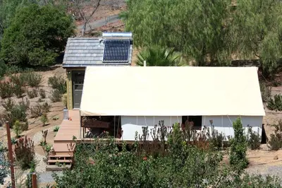 an aerial view of a house with a white roof at African-Inspired Safari Tent near San Diego for a Glamping Weekend in Vista, California in Vista