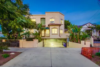 a house with a gate in front of a driveway at Sail Bay Luxury Retreat With Private Spa and Rooftop Bay View in San Diego