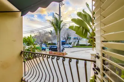 a balcony with a view of a parking lot at Sail Bay Luxury Retreat With Private Spa and Rooftop Bay View in San Diego