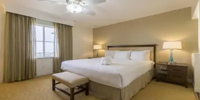 a hotel room with a large bed and a window at Grand Pacific Palisades in Carlsbad