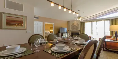 a dining room with a long table and chairs at Grand Pacific Palisades in Carlsbad