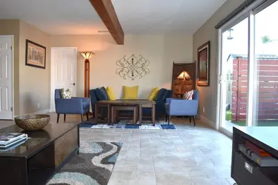 a living room with a couch and a table at Wise in San Diego