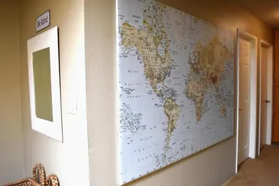 a map of the world hanging on a wall at Wise in San Diego