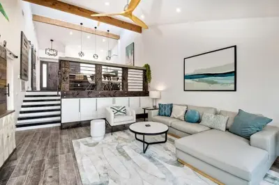 a living room with a couch and a table at Sea Bluff - Direct Beach Access in Encinitas