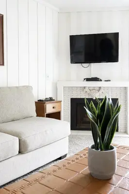 a living room with a couch and a fireplace at Oceanside Beach Condos in Oceanside