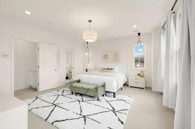 a white bedroom with a bed and a rug at Grand Luxury 4BD Estate in Irvine in Irvine