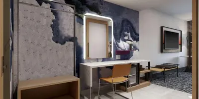 a bathroom with a sink and a mirror at Tempo By Hilton San Diego Del Mar in San Diego