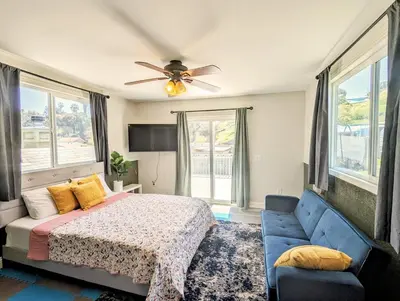 a bedroom with a bed and a ceiling fan at Entire Upstairs with 4 Bedrooms, 2 Baths and private entrance in San Diego