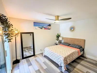 a bedroom with a bed and a ceiling fan at Entire Upstairs with 4 Bedrooms, 2 Baths and private entrance in San Diego