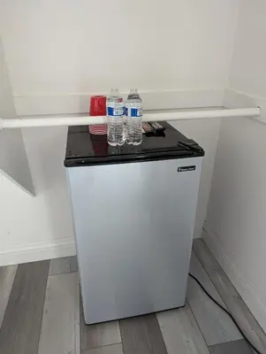 two bottles of water sitting on top of a refrigerator at Entire Upstairs with 4 Bedrooms, 2 Baths and private entrance in San Diego