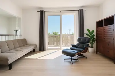 a living room with a couch and a chair and a window at Situated in the heart of Costa Mesa near 17th Street in Costa Mesa