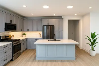 a kitchen with white cabinets and a sink at Situated in the heart of Costa Mesa near 17th Street in Costa Mesa
