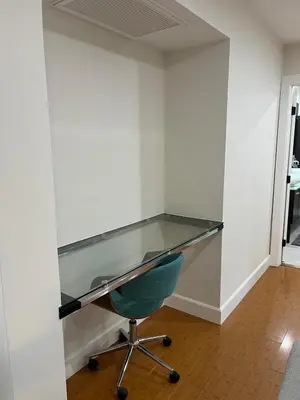 a glass desk in a room with a green chair at Stunning, Quiet Vista Retreat Minutes from Beach in Vista