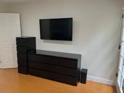 a living room with a tv on a wall at Stunning, Quiet Vista Retreat Minutes from Beach in Vista