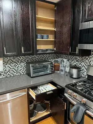a kitchen with a stove and a counter top at Stunning, Quiet Vista Retreat Minutes from Beach in Vista