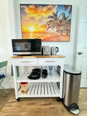 a white desk with a microwave and a computer on it at Cozy Guesthouse - 15 Min to Downtown SD in Chula Vista