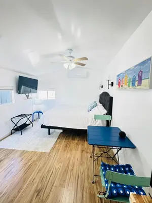 a bedroom with a bed and a ceiling fan at Cozy Guesthouse - 15 Min to Downtown SD in Chula Vista