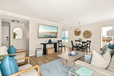 a living room with a couch and a table at Seize the Day in San Diego